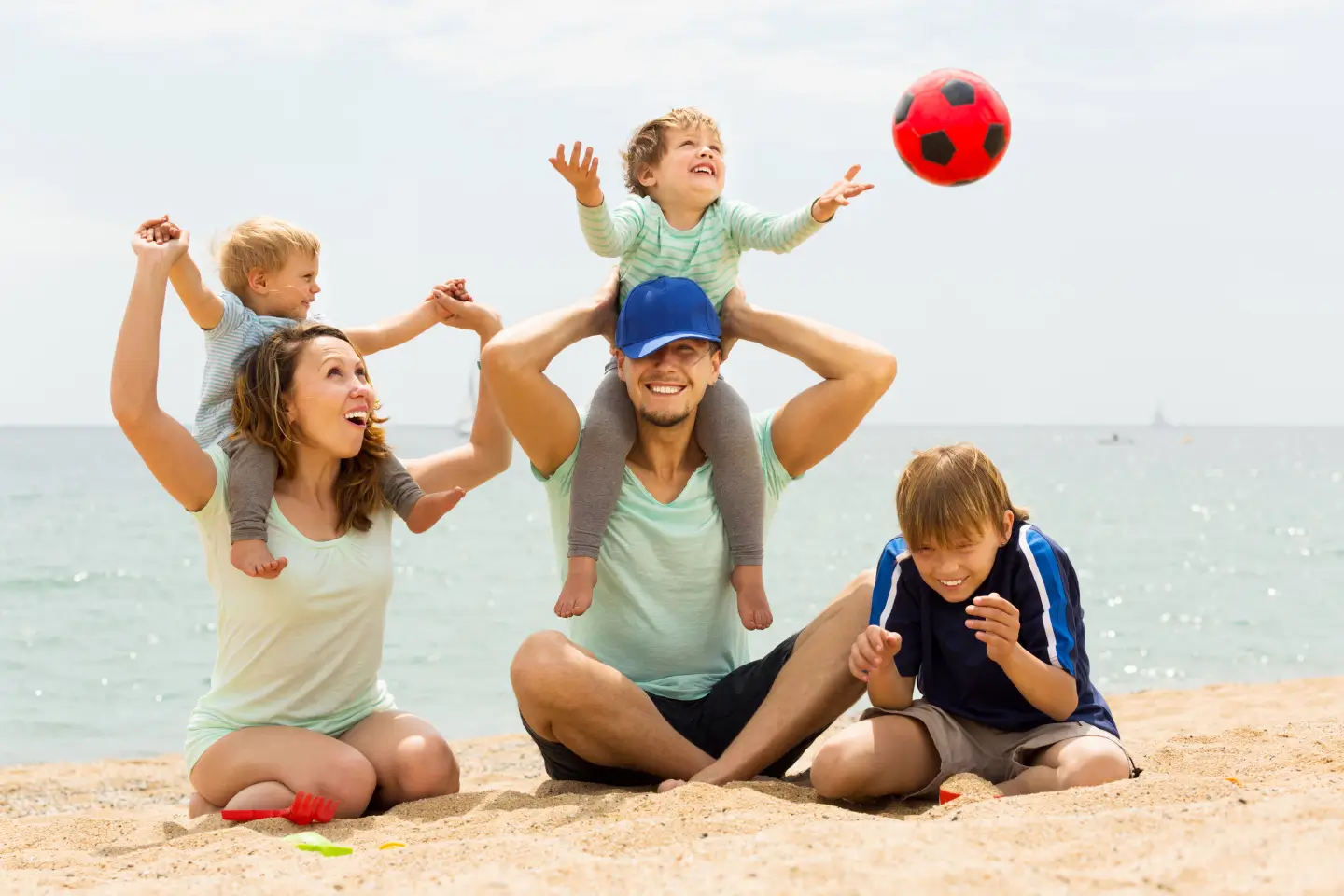 2026/04/positive-family-five-playing-sea-beach.webp